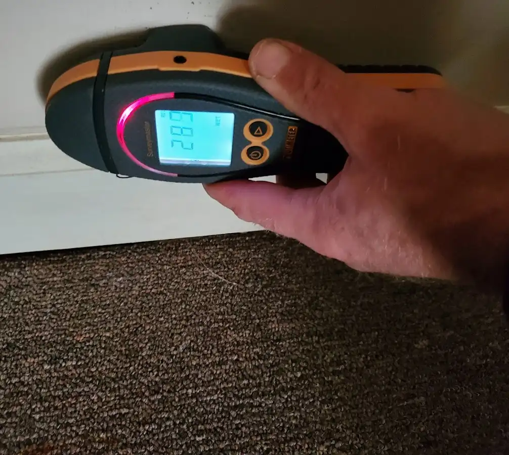 Moisture detection at baseboard during Storm Damage Restoration in Oxon Hill